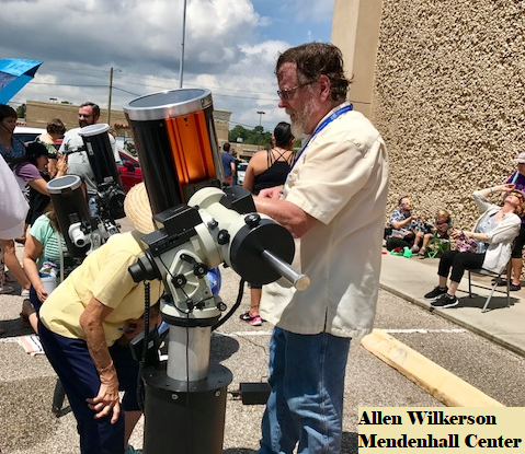 Allen showing the public the solar eclipse